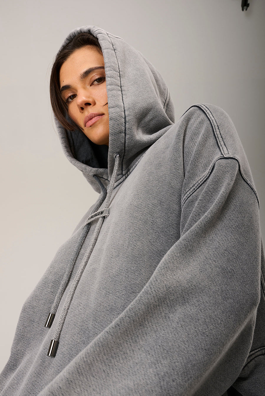 woman wearing a beige hoodie